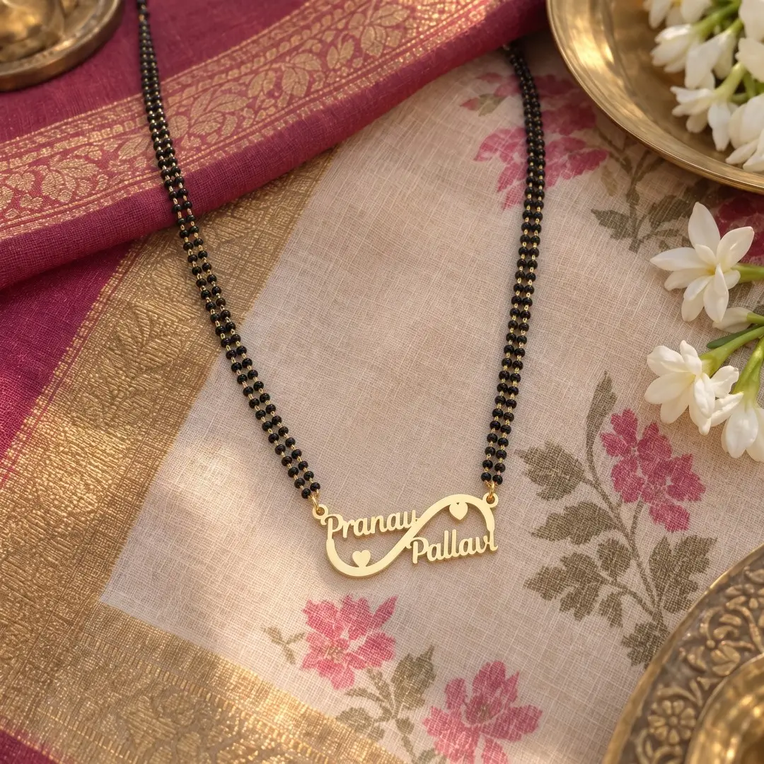 Double Heart Infinity Couple Name Necklace – With a black-beaded chain on floral fabric Double Heart Infinity Couple Name Necklace with a black-beaded chain on floral fabric