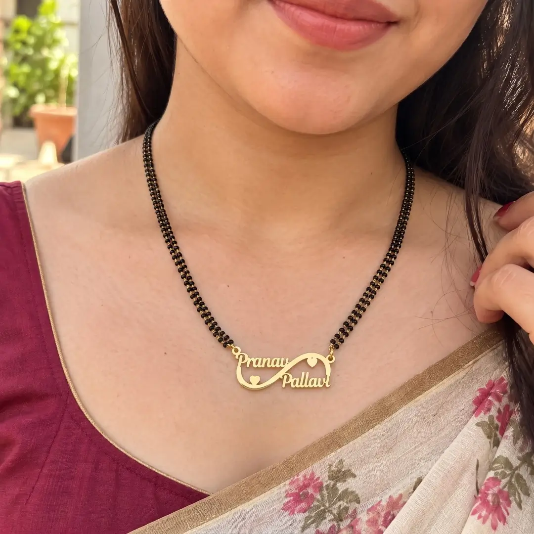 Double Heart Infinity Couple Name Necklace – With a black-beaded chain worn with a sari Double Heart Infinity Couple Name Necklace with a black-beaded chain worn with a sari