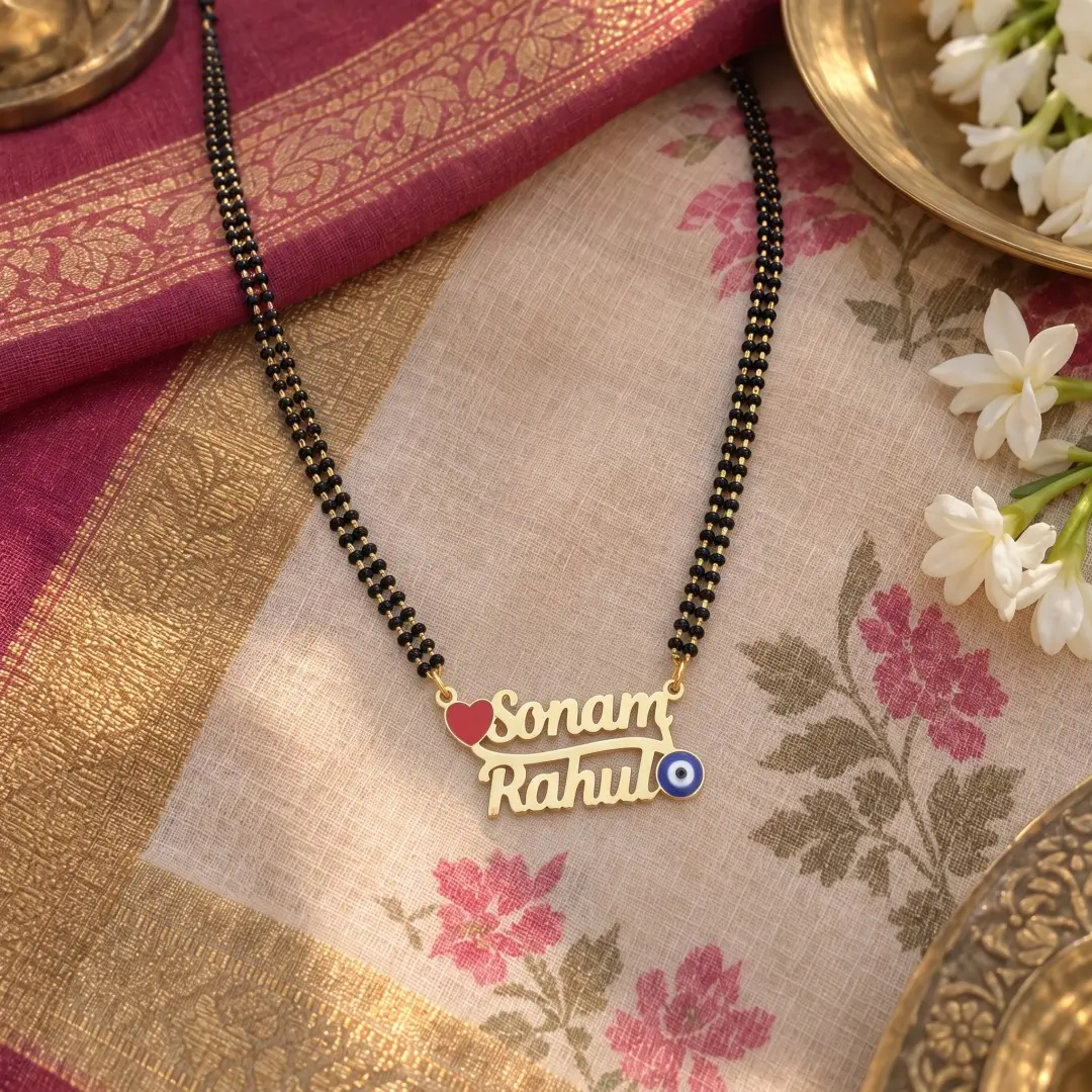 Rose and Evil Eye Couple Name Necklace Pendant – With a black-beaded chain on floral fabric Rose and Evil Eye Couple Name Necklace Pendant with a black-beaded chain on floral fabric