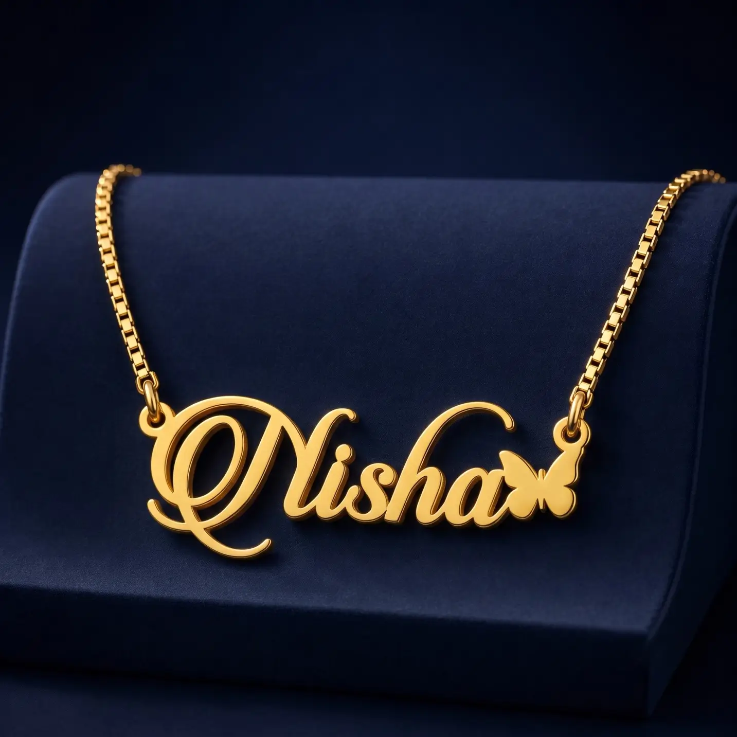 Personalized Butterfly Name Necklace – Velvet Display Gold-tone script name necklace with a small butterfly on a navy velvet display