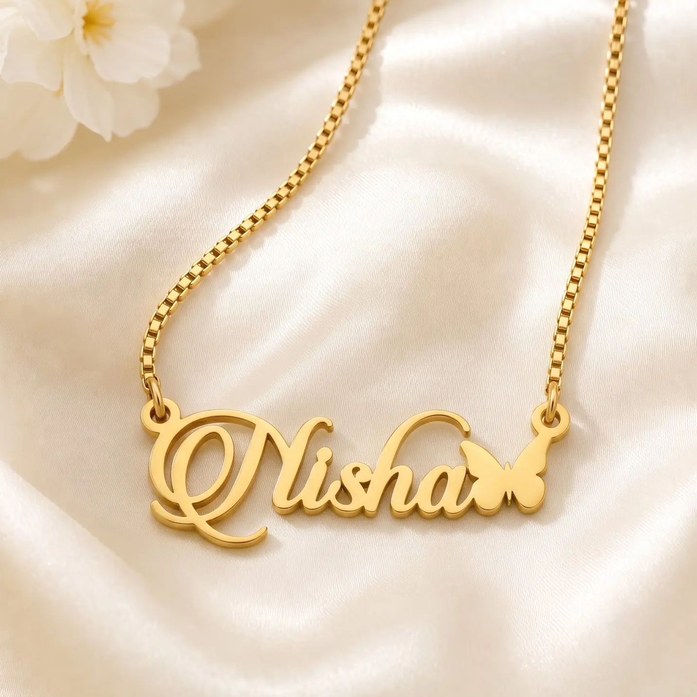 Personalized Butterfly Name Necklace – Satin Detail Gold-tone script name necklace with a small butterfly on ivory satin