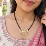 Crown and Heart Couple Name Necklace with a black-beaded chain shown on a model
