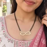 Side Heart Infinity Couple Name Necklace with a black-beaded chain shown on a model