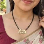 Sparkle Crown Couple Name Necklace with a black-beaded chain worn with a sari