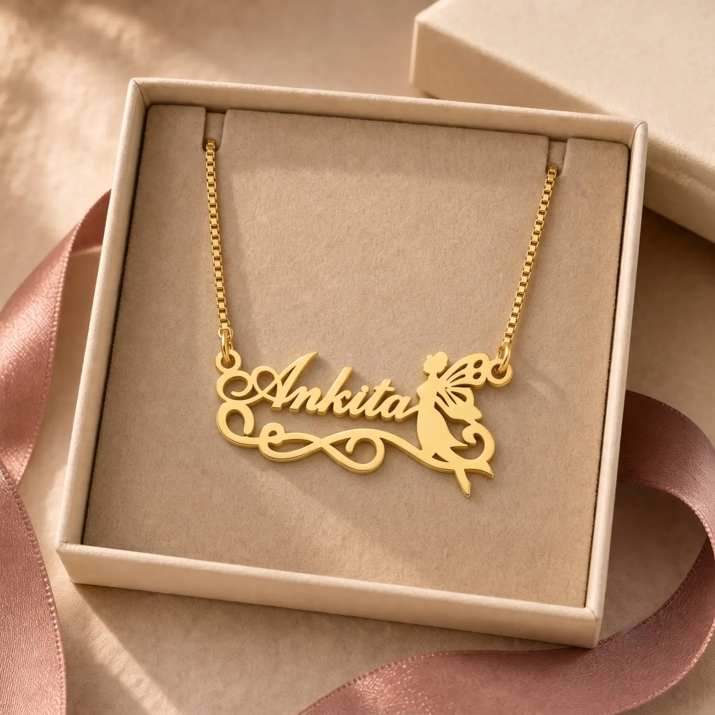 Fairy Angel Name Pendant – Jewellery Box Gold-tone fairy silhouette name pendant displayed in an open beige jewellery box