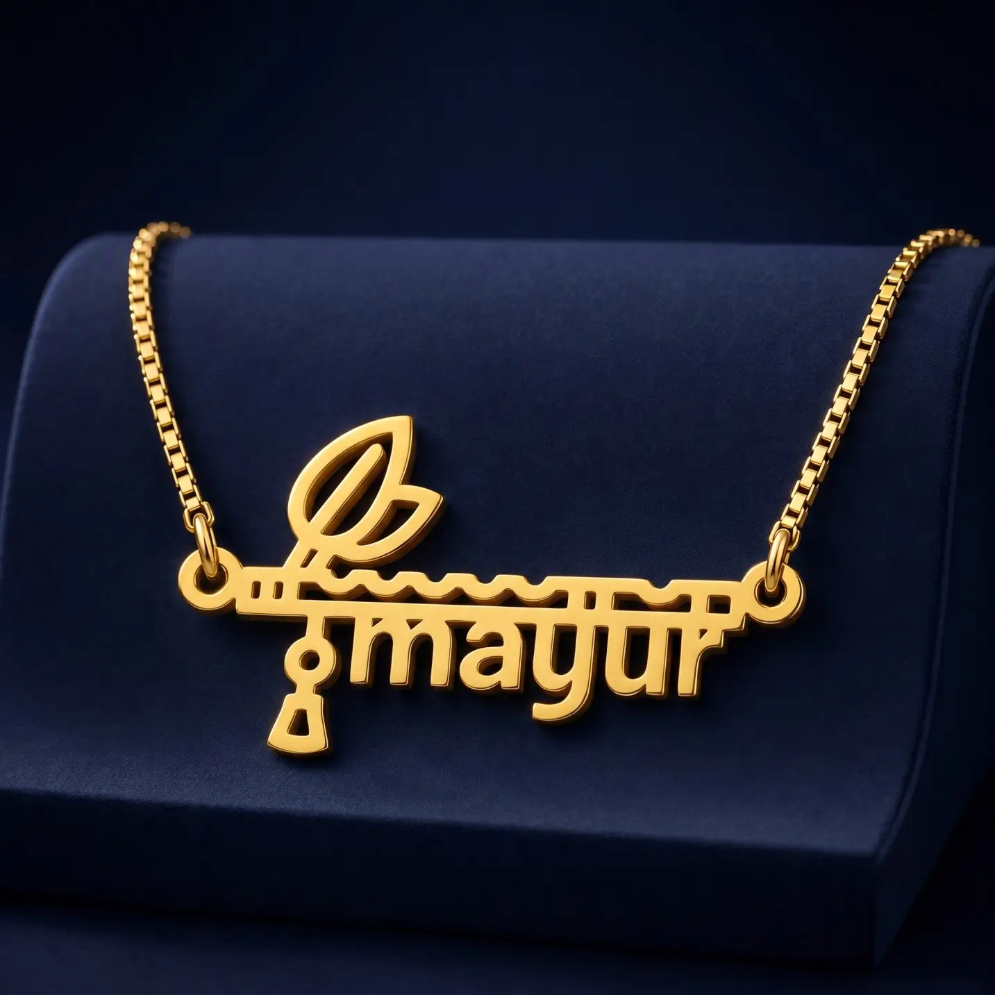 Flute and Feather Name Pendant – Velvet Display Gold-tone flute and feather name pendant on a navy velvet display