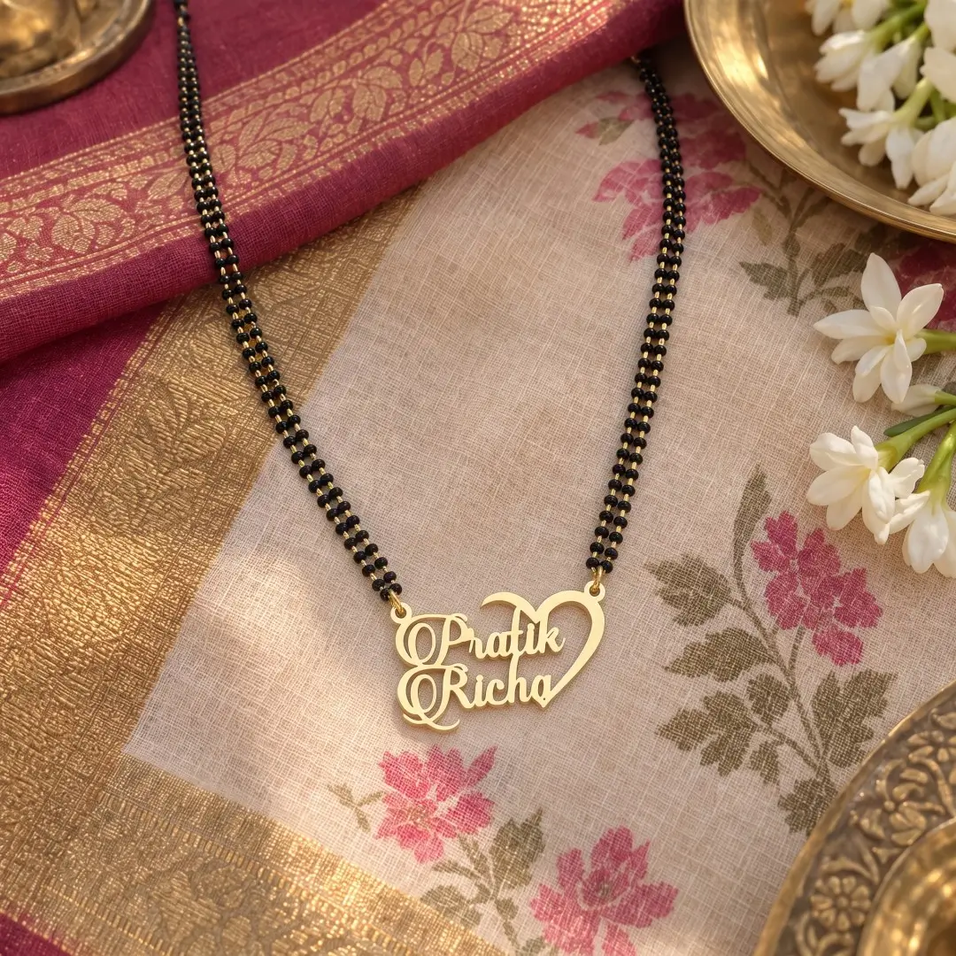 Half Heart Couple Name Necklace – With a black-beaded chain on floral fabric Half Heart Couple Name Necklace with a black-beaded chain on floral fabric