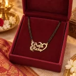 Half Heart Couple Name Necklace with a black-beaded chain in a red display box