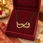 Infinity Heart Couple Name Mangalsutra Pendant with a black-beaded chain in a red display box