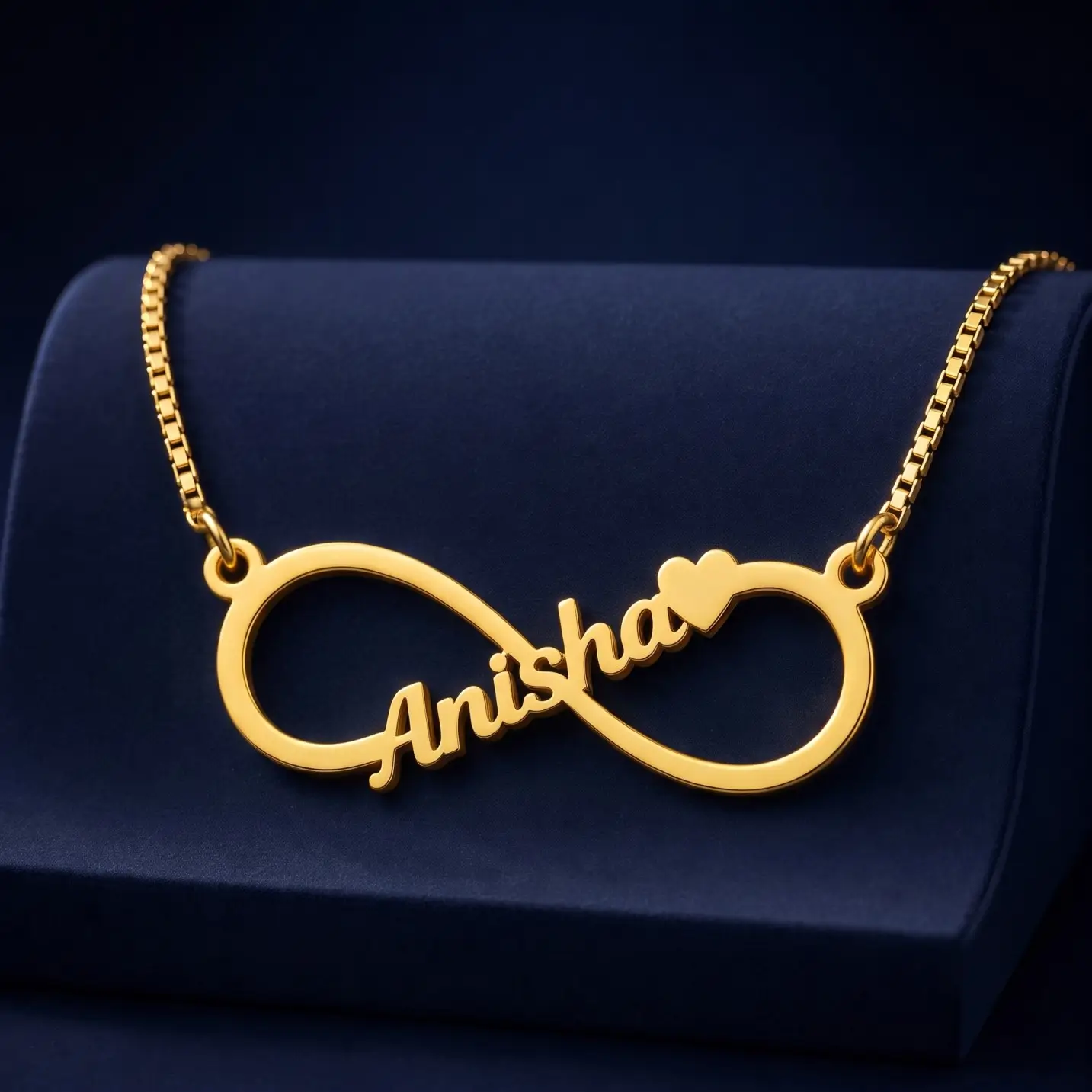 Personalized Infinity Name Necklace – Velvet Display Gold-tone infinity outline name necklace on a navy velvet display