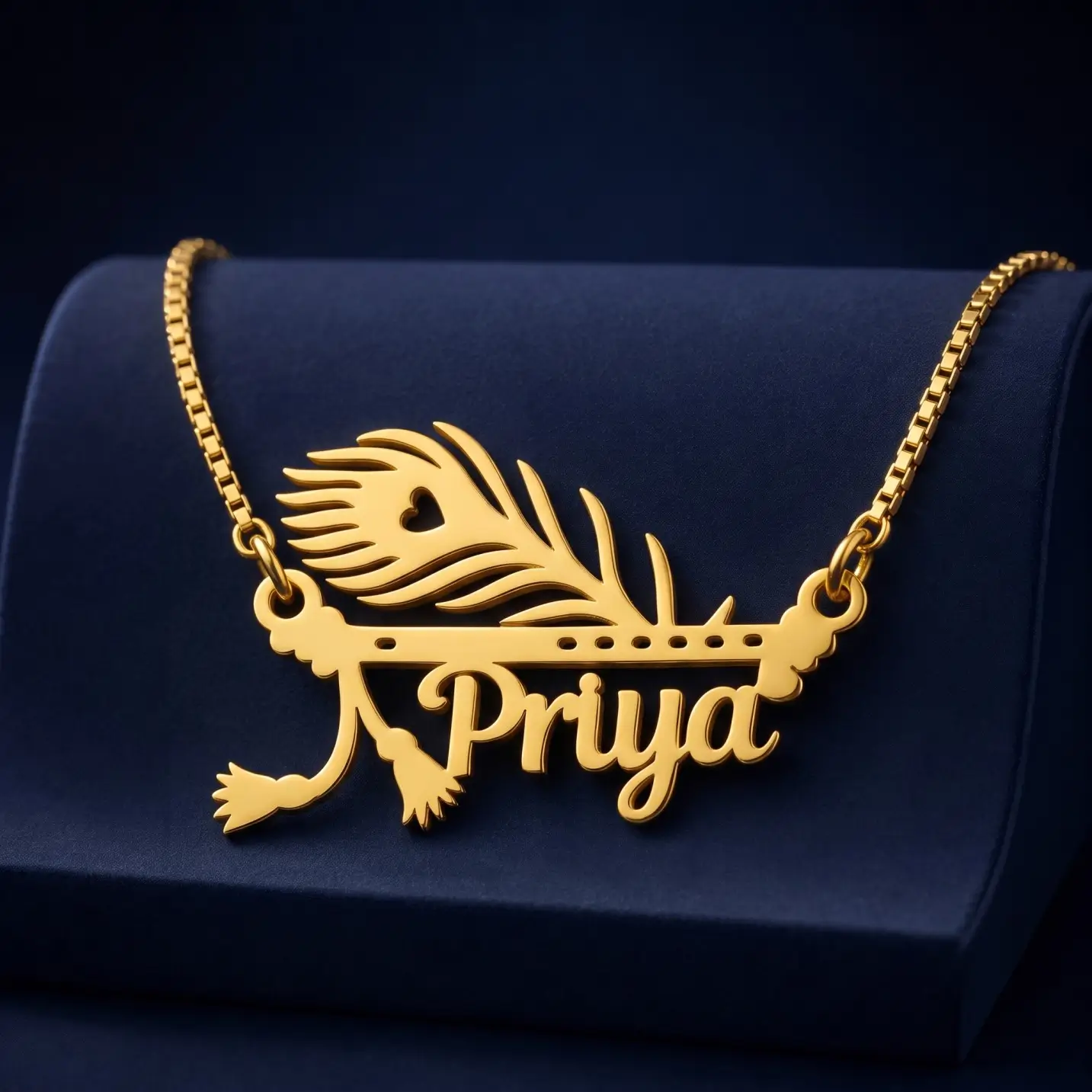 Mor Pankh Personalized Name Pendant – Velvet Display Gold-tone peacock feather and flute name pendant on a navy velvet display