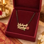 Red Rose Couple Name Necklace with a black-beaded chain in a red display box