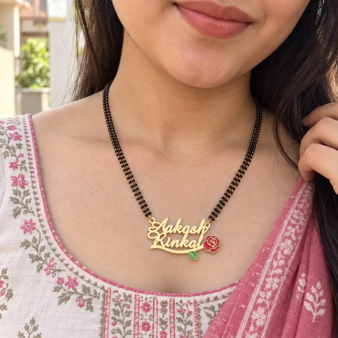 Red Rose Couple Name Necklace – With a black-beaded chain shown on a model Red Rose Couple Name Necklace with a black-beaded chain shown on a model