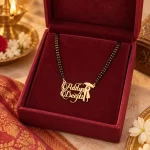 Umbrella Couple Name Necklace with a black-beaded chain in a red display box
