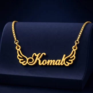 Gold-tone angel wings name necklace on a navy velvet display