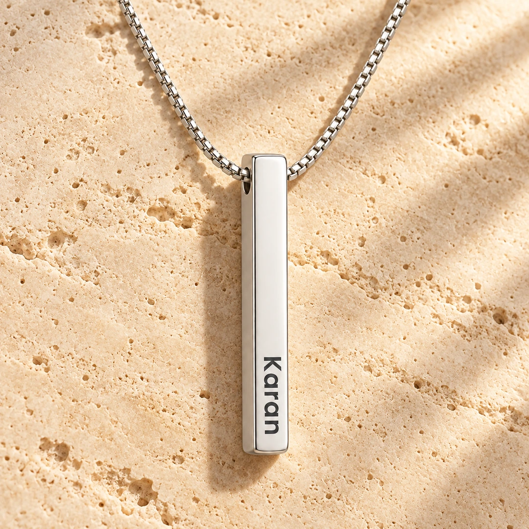 Personalized Silver Finish 3D Bar Pendant – On a rough stone surface Personalized Silver Finish 3D Bar Pendant on a rough stone surface