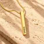 Personalized Golden 3D Bar Pendant on a rough stone surface