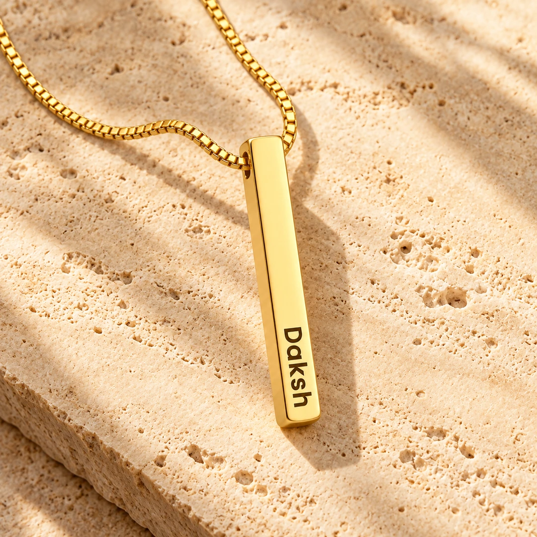 Personalized Golden 3D Bar Pendant – On a rough stone surface Personalized Golden 3D Bar Pendant on a rough stone surface
