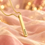 Personalized Golden 3D Bar Pendant on peach fabric