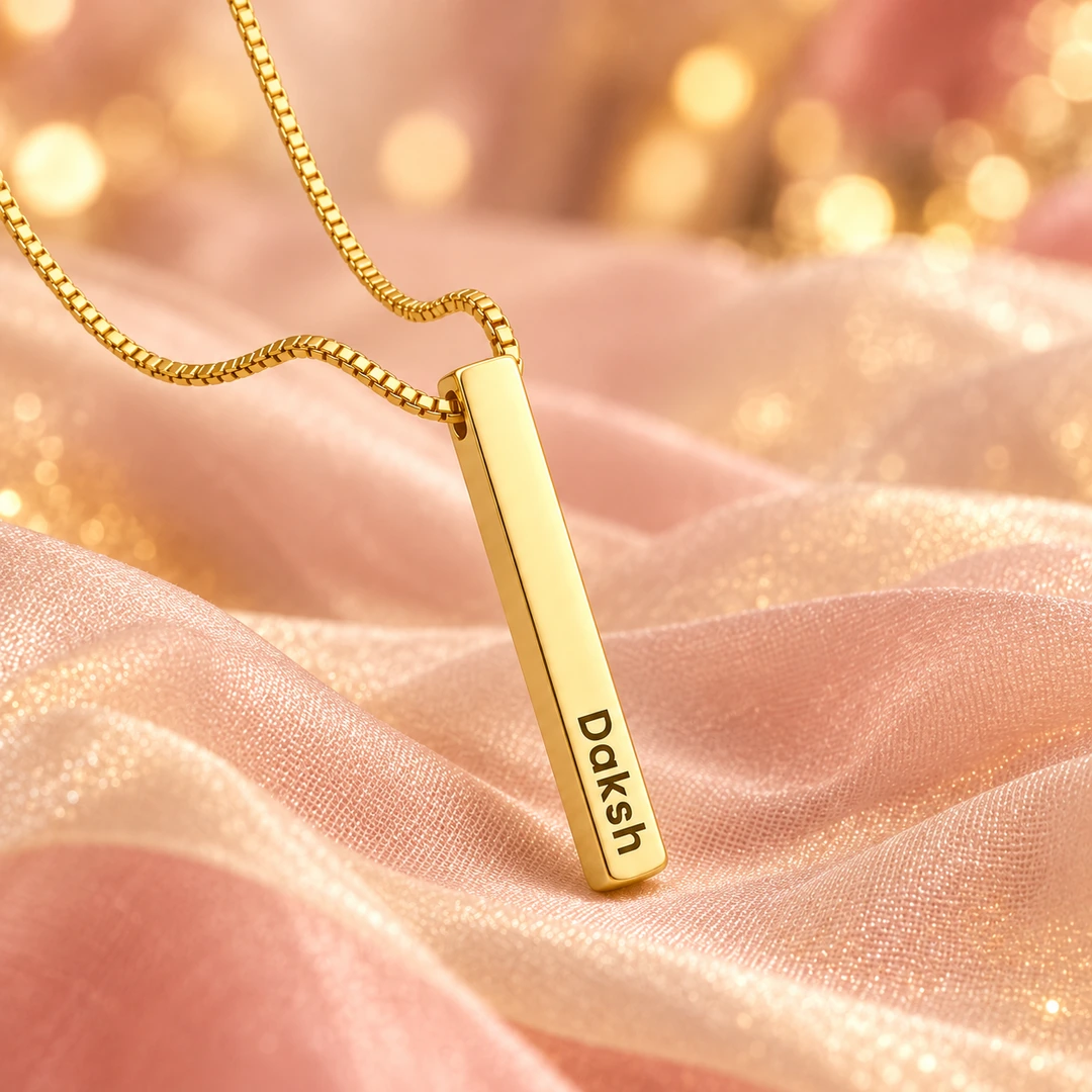 Personalized Golden 3D Bar Pendant – On peach fabric Personalized Golden 3D Bar Pendant on peach fabric