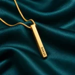 Personalized Golden 3D Bar Pendant on dark green fabric